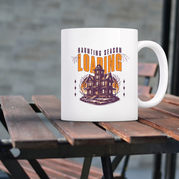 Haunting Season Loading – the perfect anticipatory mug for Halloween lovers and coffee enthusiasts.