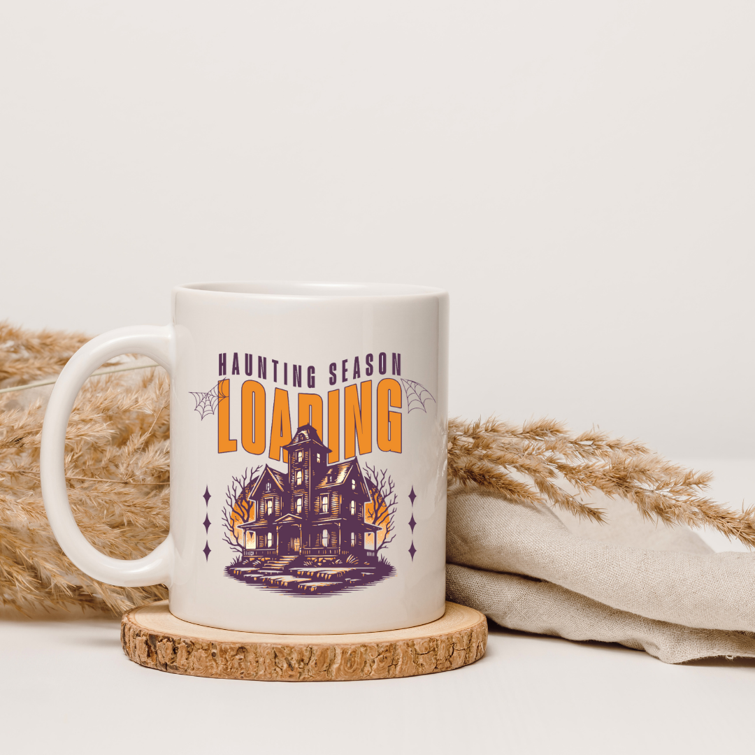 Haunting Season Loading – the perfect anticipatory mug for Halloween lovers and coffee enthusiasts.