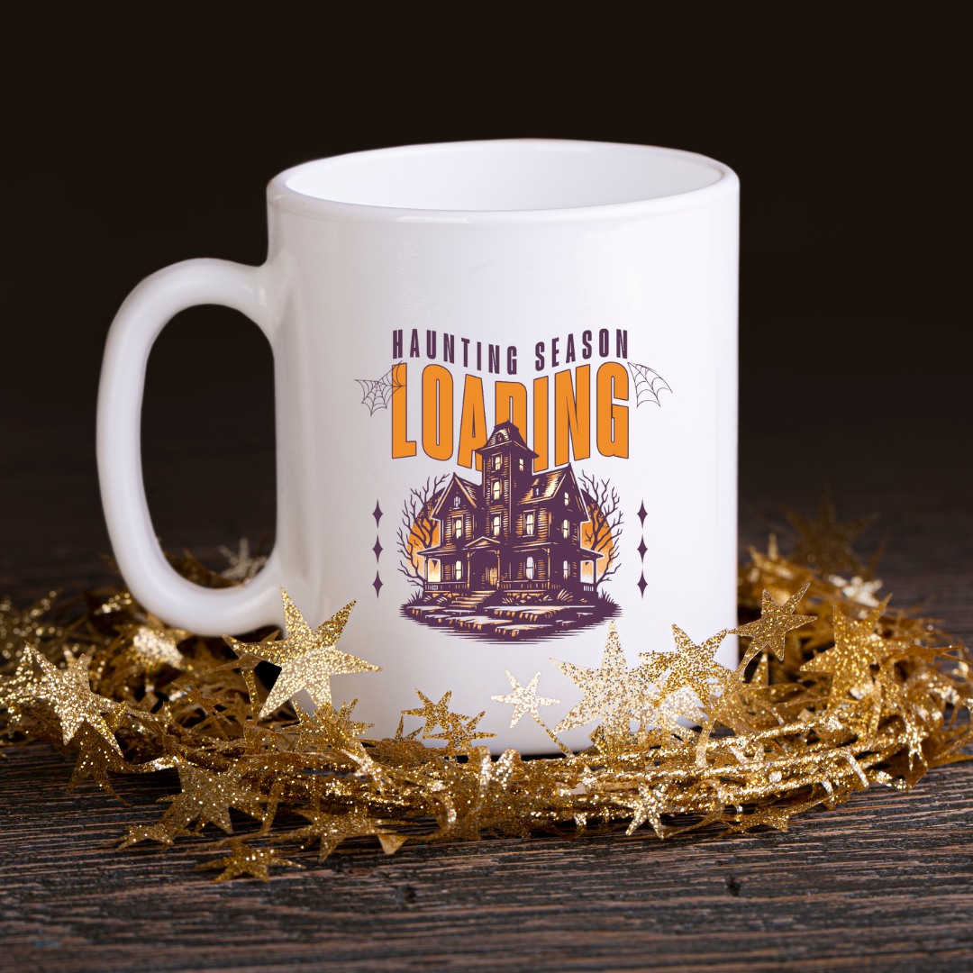 Haunting Season Loading – the perfect anticipatory mug for Halloween lovers and coffee enthusiasts.