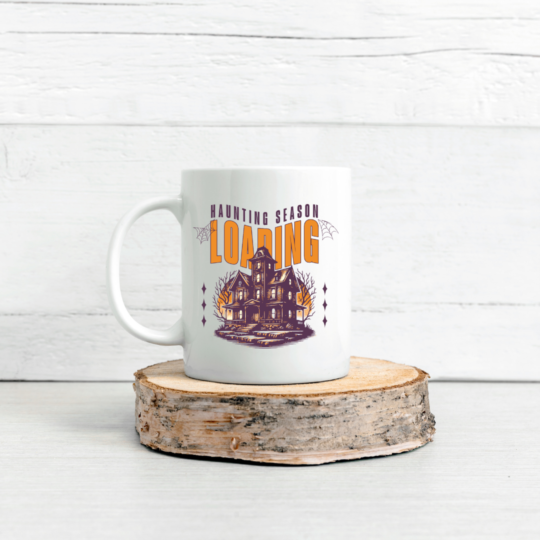Haunting Season Loading – the perfect anticipatory mug for Halloween lovers and coffee enthusiasts.